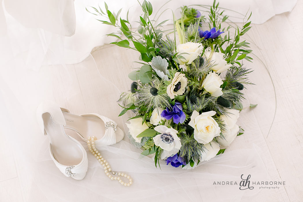 Beautiful wedding shoes, jewelry and bouquet