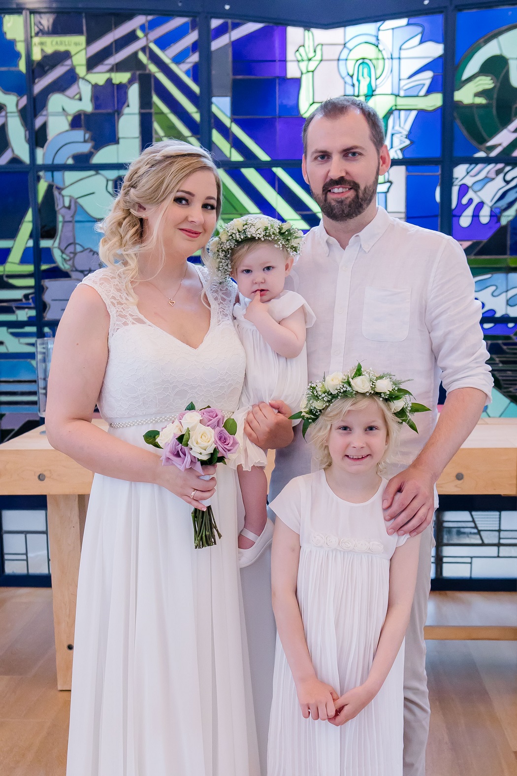 bride, groom and flower girls