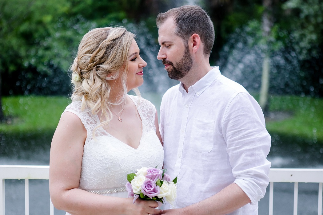 bride and groom pose for pictures