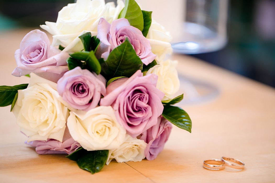 wedding bands with bouquet