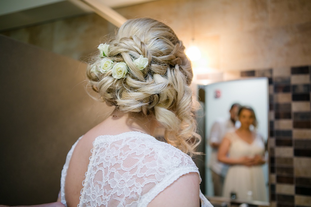 unique bridal hair style with white roses