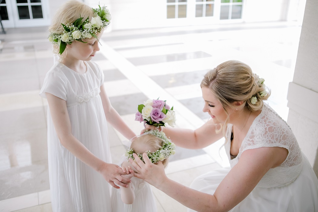 bride and flower girls prepare for ceremony