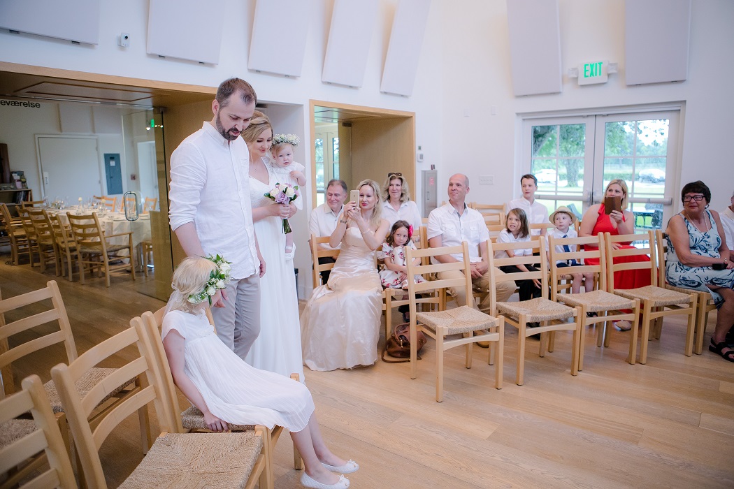 bride and groom walk down aisle