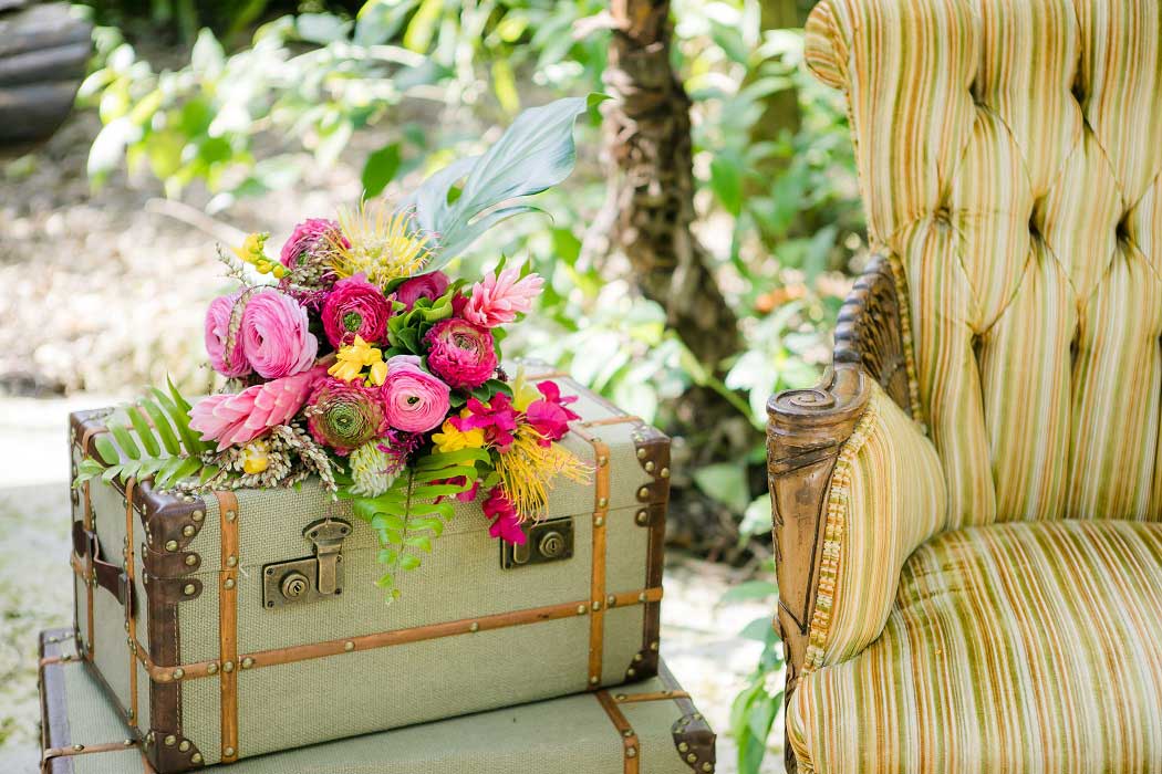 bridal bouquet on top of vintage suitcases