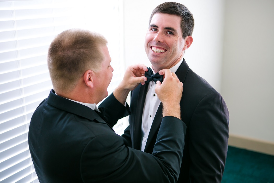 best man gets groom dressed