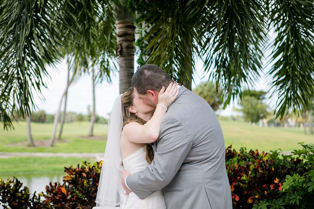 bride and groom kiss after their pompano beach wedding