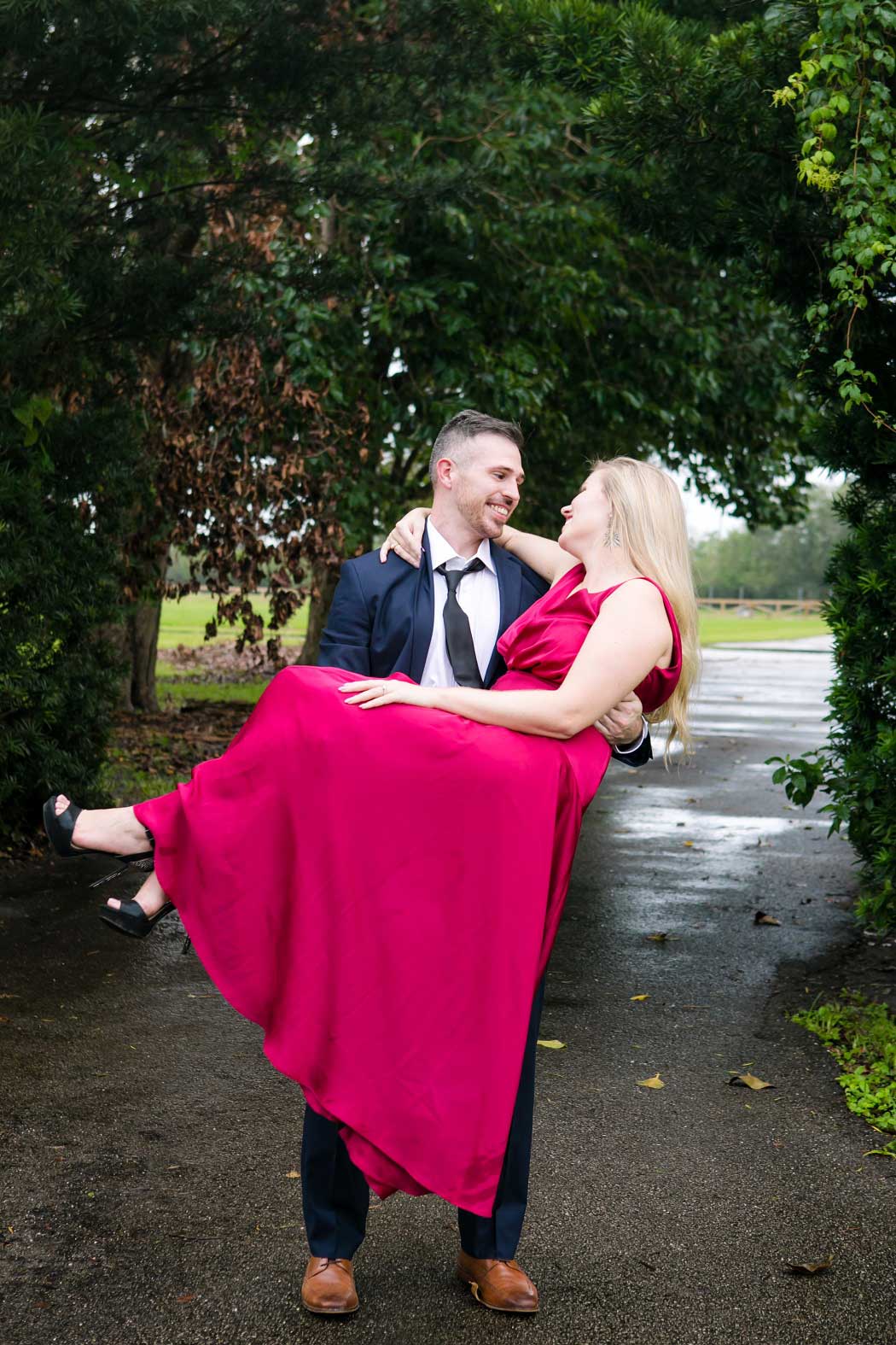 engagement photoshoot ideas for unique posing | stunning red maxi dress | Andrea Harborne Photography