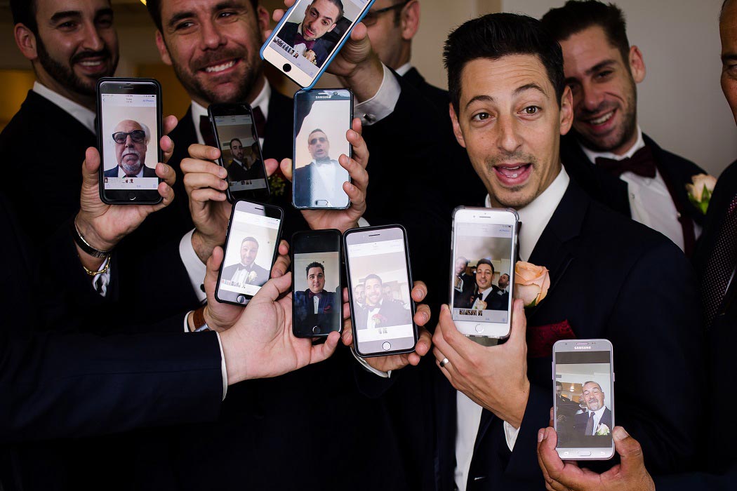 groom and groomsmen take fun photographs for wedding | unique wedding images for groomsmen | biltmore hotel miami wedding