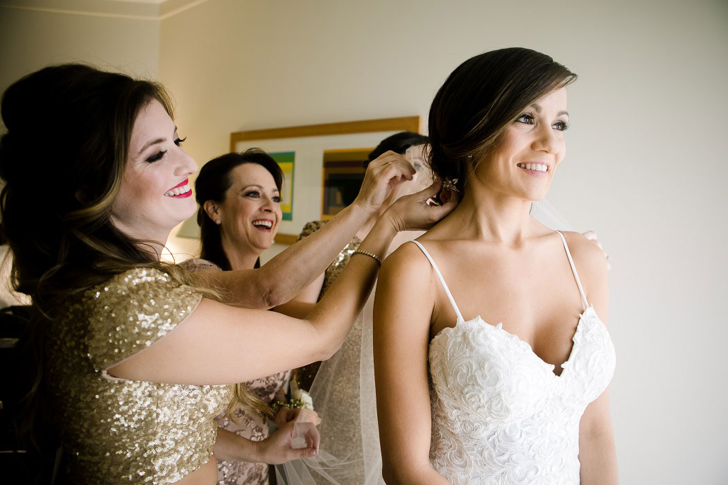 bride getting ready with her bridesmaids | biltmore hotel miami modern wedding