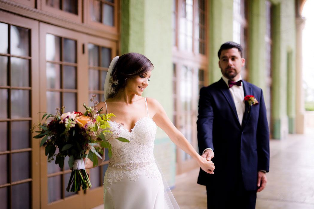 bride and groom after their first look at biltmore hotel miami wedding ceremony