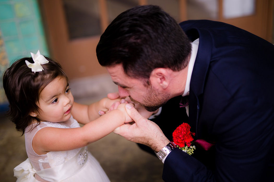 groom and cute flower girl during modern biltmore hotel miami wedding