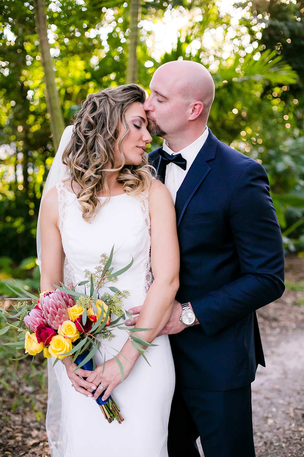 unique posing idea for bride and groom portraits | living sculpture sanctuary davie