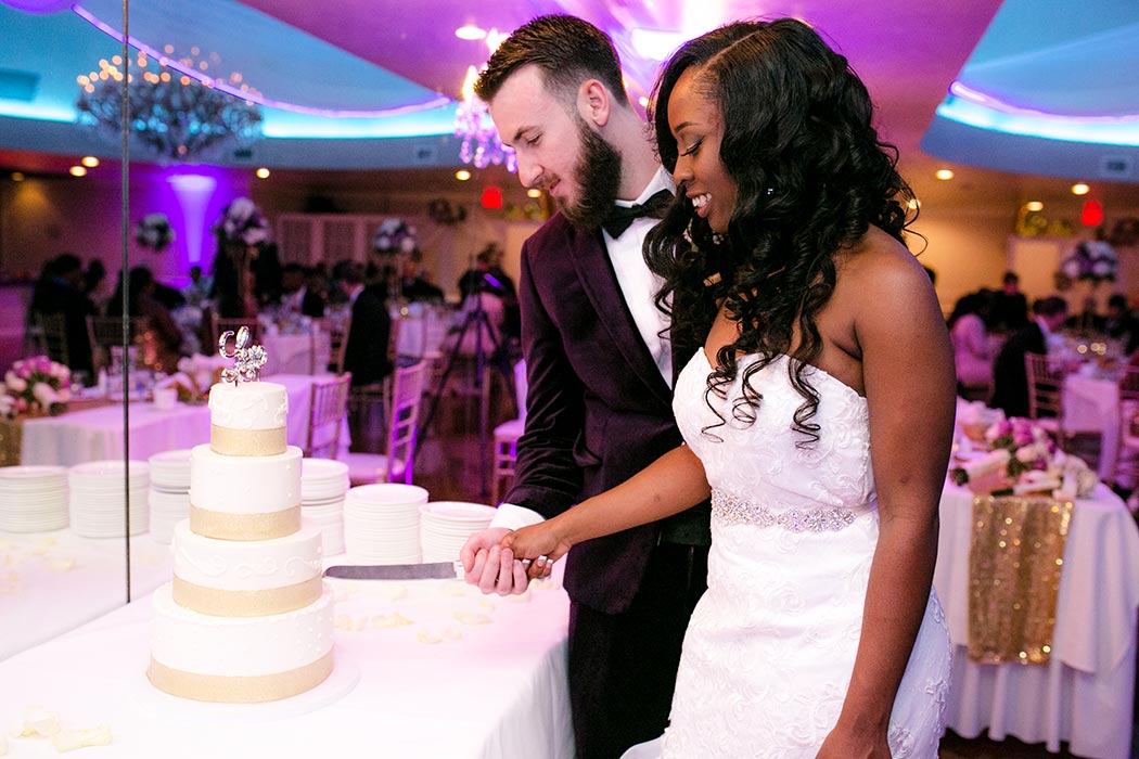 bride and groom cut the cake at a wedding in royal fiesta deerfield beach