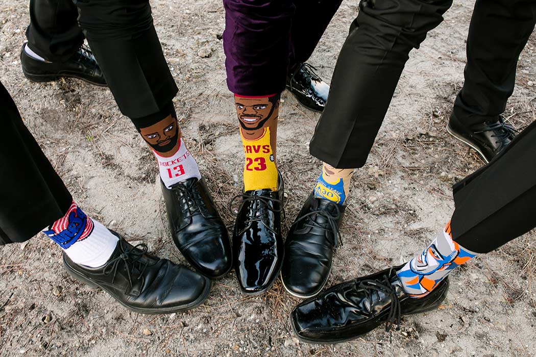 fun photograph of groom and his groomsmen's socks | royal fiesta deerfield beach wedding