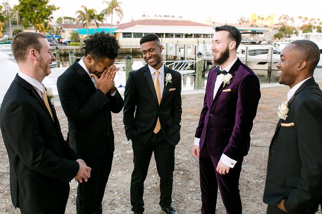 groom and groomsmen candid images before ceremony at royal fiesta deerfield beach