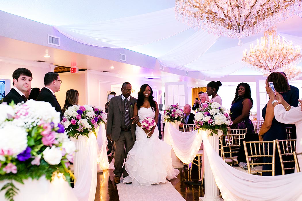 bride walks down aisle during ceremony | wedding photographer fort lauderdale