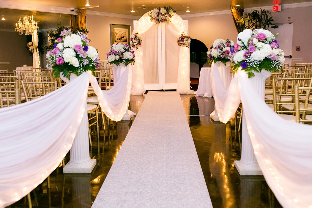 wedding aisle with white and pink roses | royal fiesta deerfield beach wedding pictures