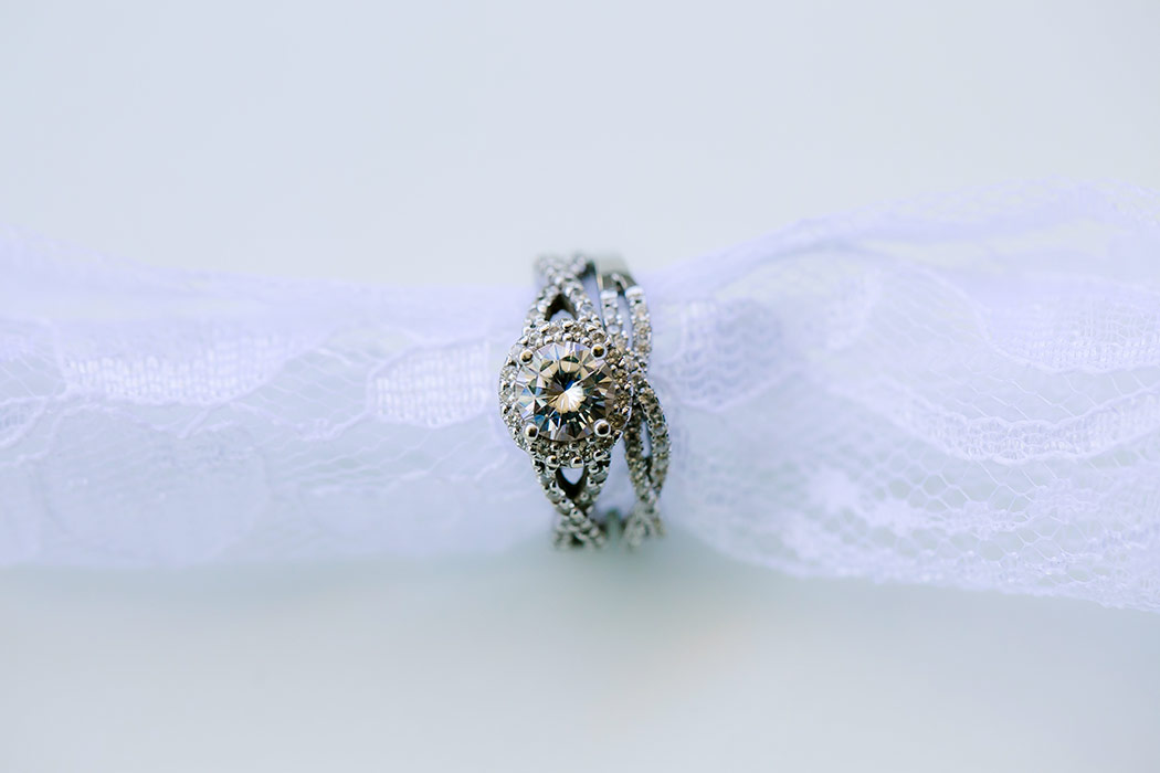 diamond engagement and wedding ring wrapped in lace | wedding photographer fort lauderdale