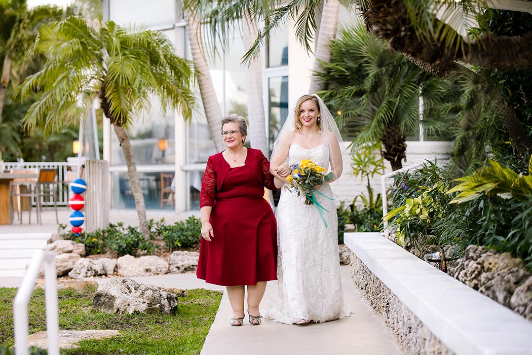 bride and her mother walking down the aisle | wedding photography fort lauderdale