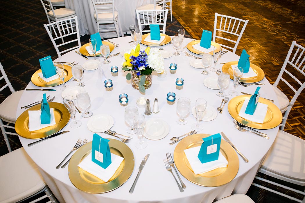 blue and yellow nautical themed wedding table settings