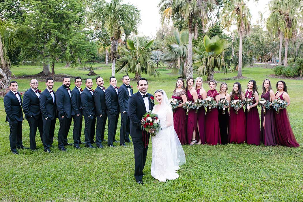 bride and groom with wedding party photograph