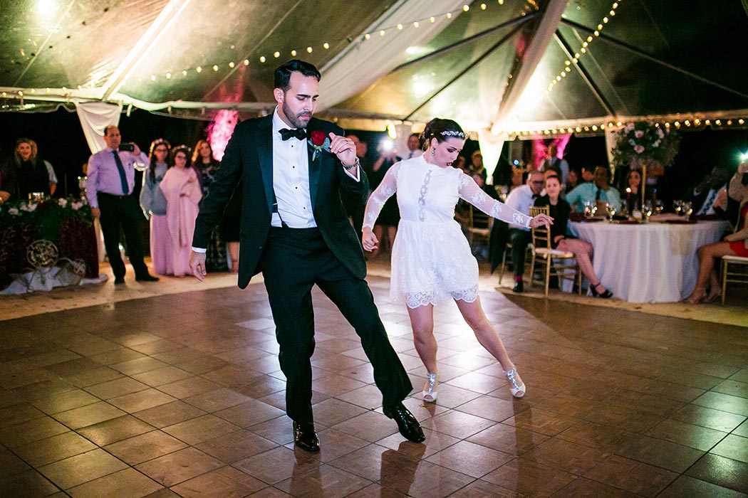 bride and grooms first dance is a salsa