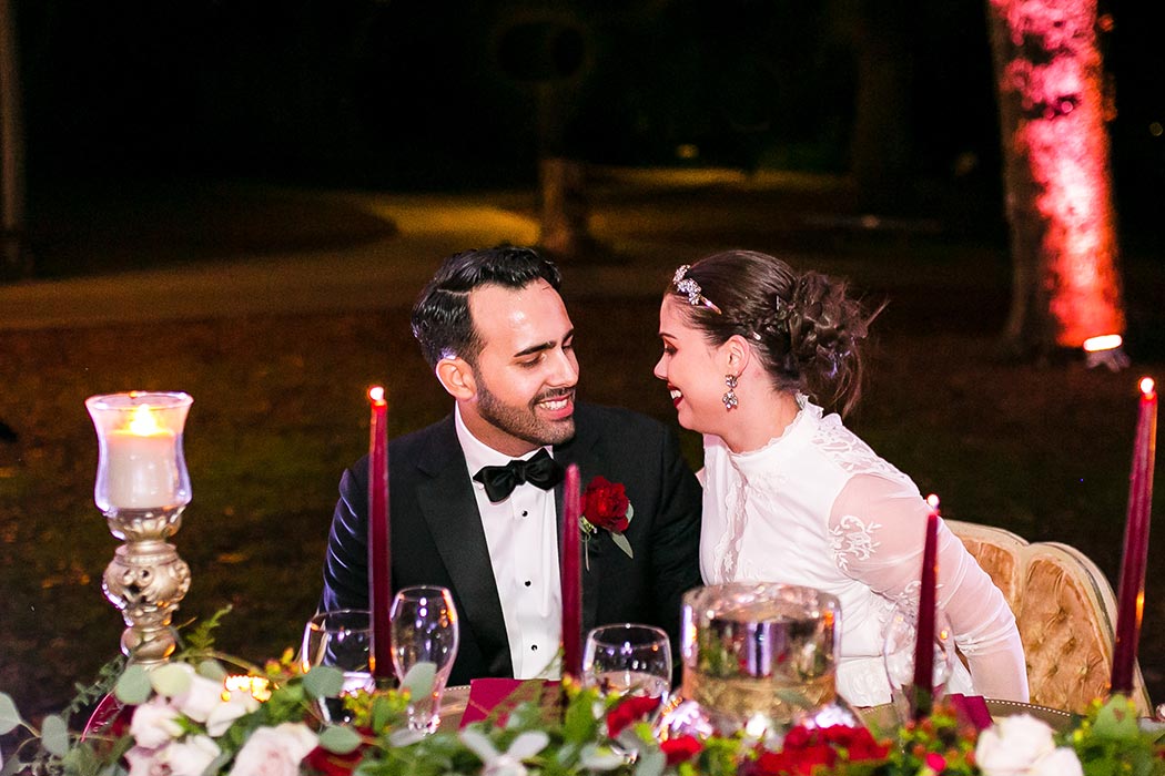 bride and groom at the sweetheart table | flamingo gardens wedding