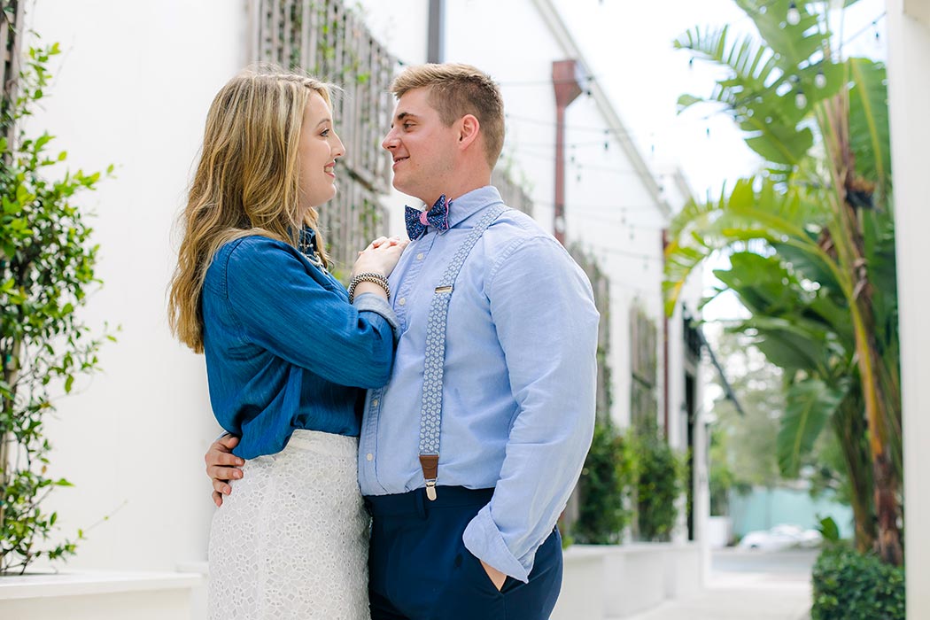 couple pose for romantic engagement photoshoot on las olas boulevard