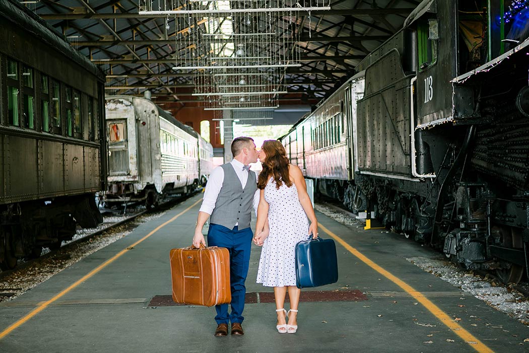 vintage inspired photoshoot with luggage in train museum | engagement photography fort lauderdale | vintage engagement session with trains