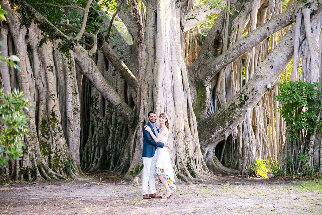 unique fun picture of engagement session in park with large tree | engagement photographer fort lauderdale