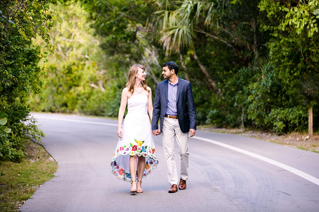 couple walking in hugh taylor birch state park fort lauderdale during engagement photoshoot | engagement photography in fort lauderdale