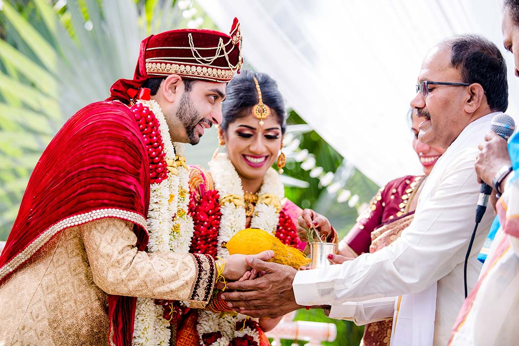 bride and groom pose for indian wedding photographs | south florida indian wedding photographer