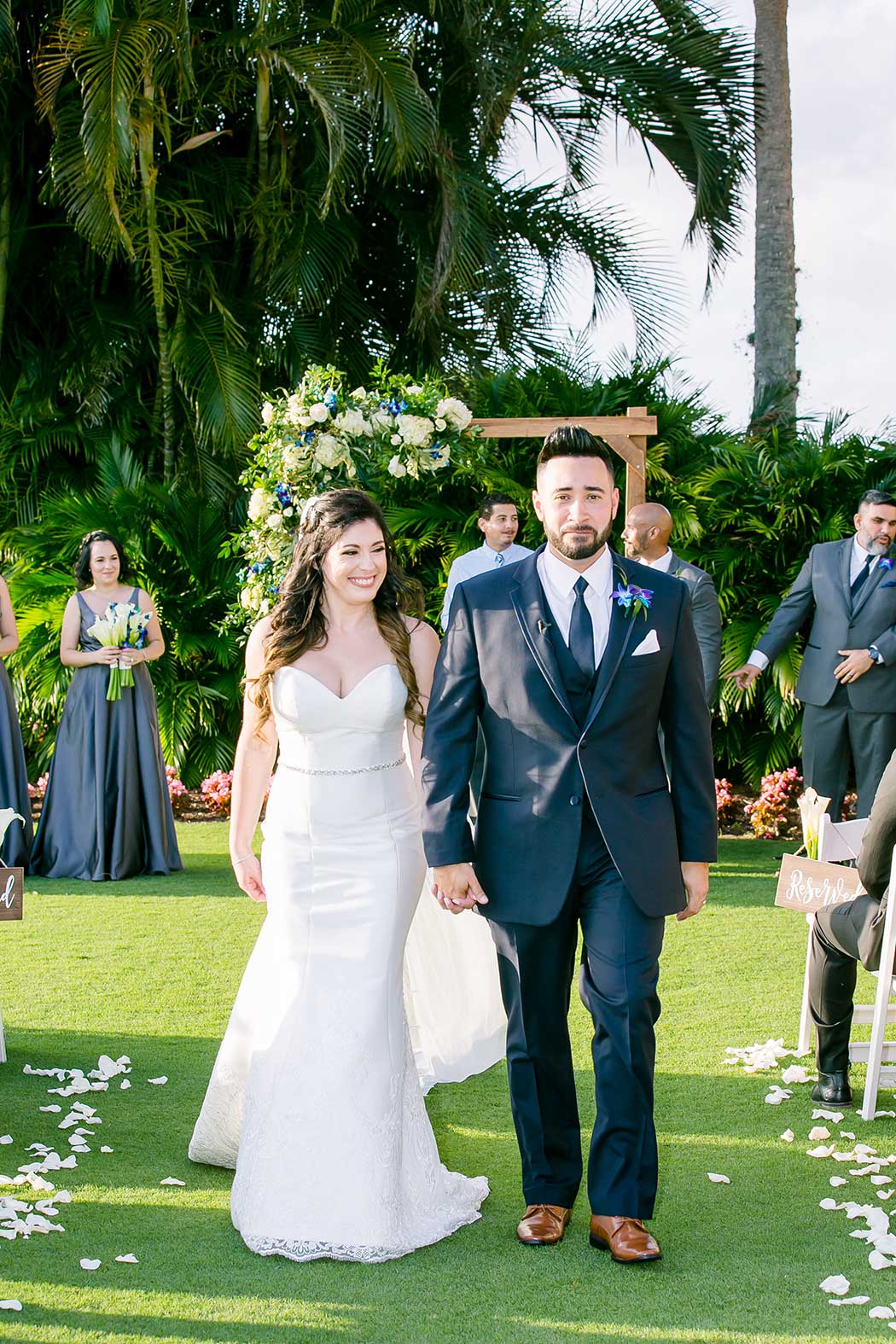 modern wedding at breakers west country club palm beach | bride and groom walk down aisle