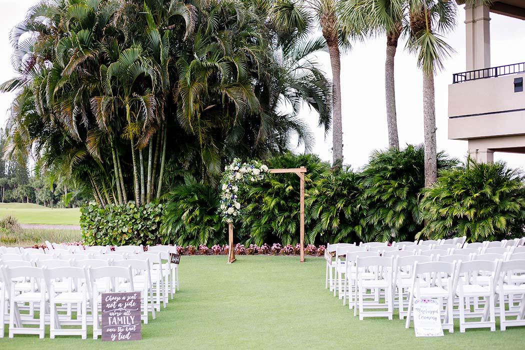 simple ceremony area at breakers west country club | wooden wedding ceremony arch with yellow roses