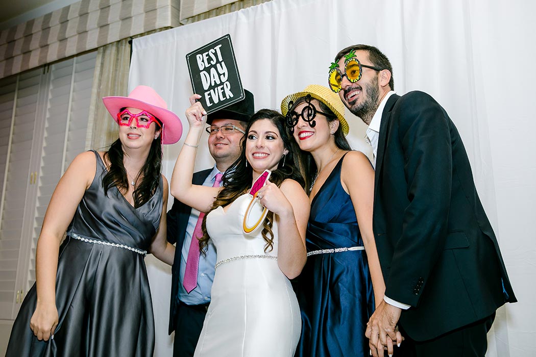 bride and guests in photobooth | modern wedding at breakers west country club | wedding photographer fort lauderdale