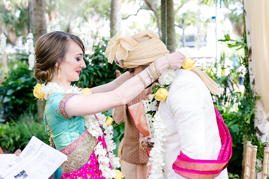 indian bride and groom exchanging flower garlands | modern indian fusion wedding ceremony in south florida