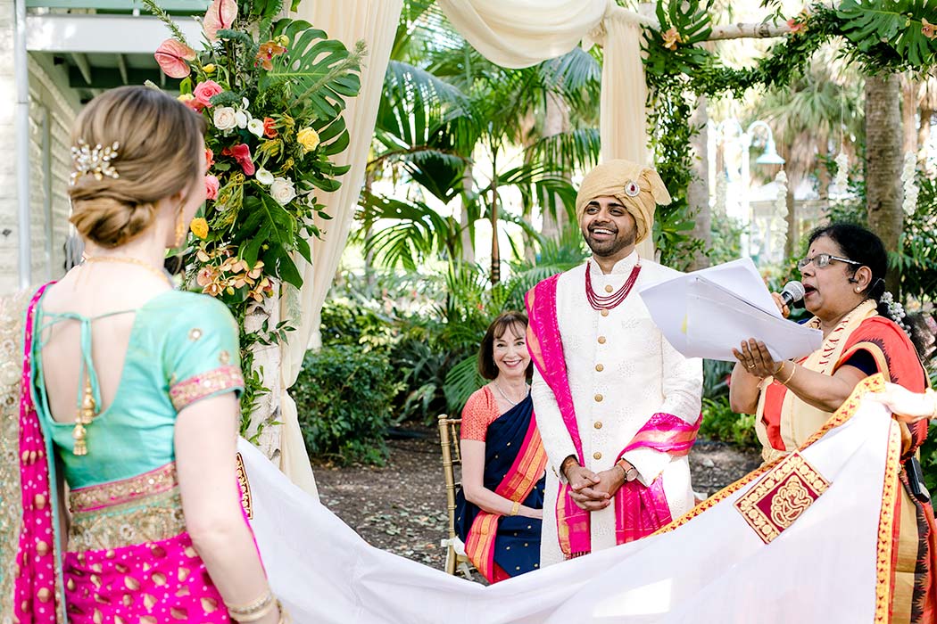 modern indian catholic wedding | fort lauderdale indian wedding | bride revealed to indian groom on mandap