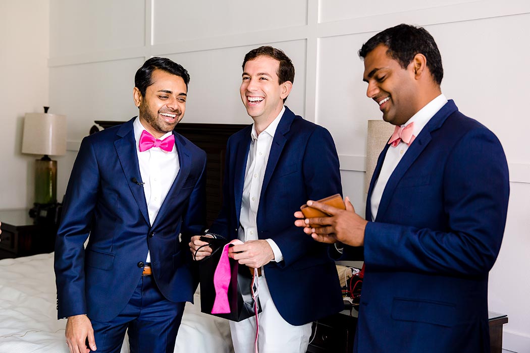 indian wedding in fort lauderdale | indian fusion wedding fort lauderdale | indian groom getting ready | navy blue wedding suit pink bow tie | photograph of groom and groomsmen