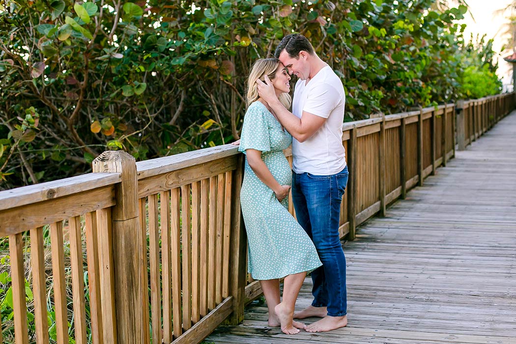 woman and man pose for maternity photography | cute maternity pose | maternity photoshoot on beach | maternity photographer fort lauderdale