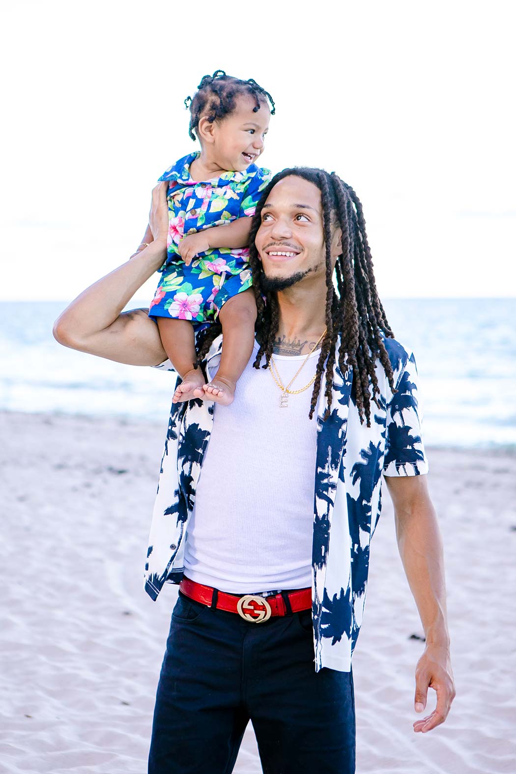 dad with son on shoulders | son sits on dad shoulders | dad and son beach photography | fort lauderdale beach photoshoot