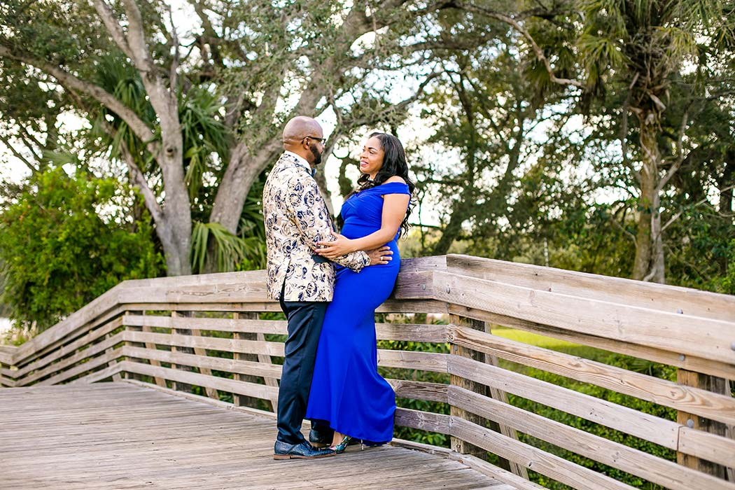 black couple pose for tree tops park photos | engagement photoshoot tree tops park | formal attire for photography | black couples' photogrpahy pose