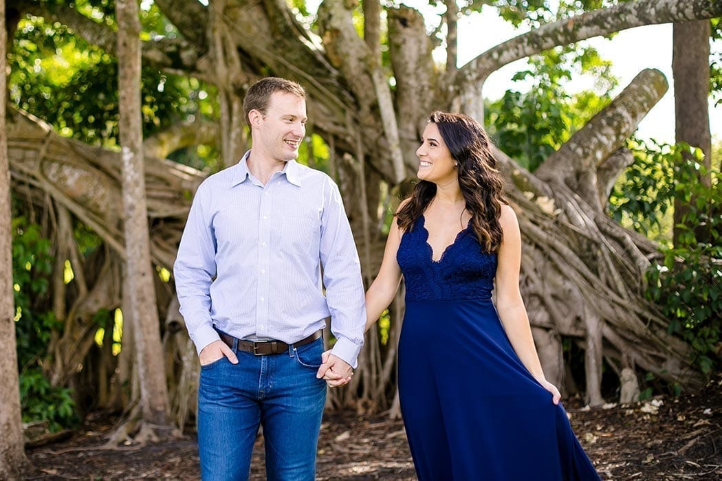 engaged couple pose for photos in robbins preserve | engagement photography in south florida