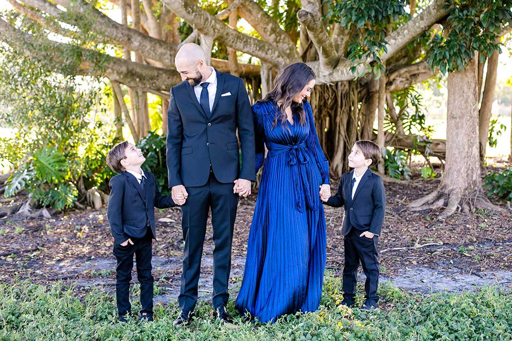 elegant family photoshoot robbins preserve | family of 4 holding hands | images of formal family photos in a park | family photographer fort lauderdale | south florida family photographer
