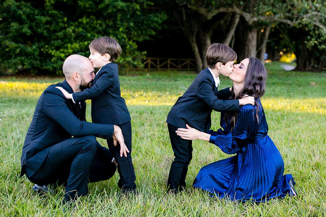 family kiss during photoshoot | south florida elegant family photography session | robbins preserve elegant family photoshoot