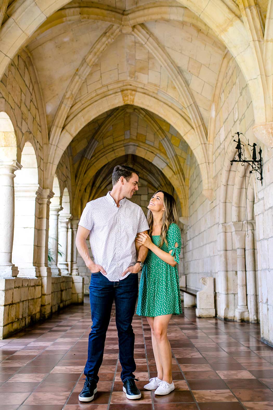 engagement photos inside spanish monastery miami | girl wearing green summer dress for engagement photos
