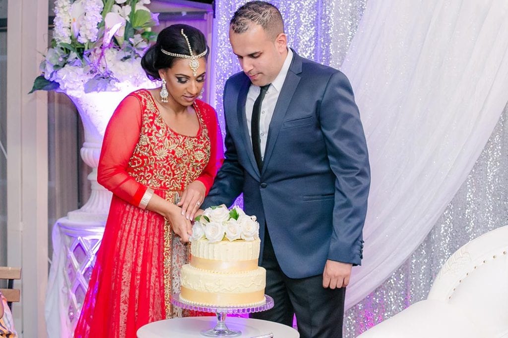cake cutting during indian wedding ceremony