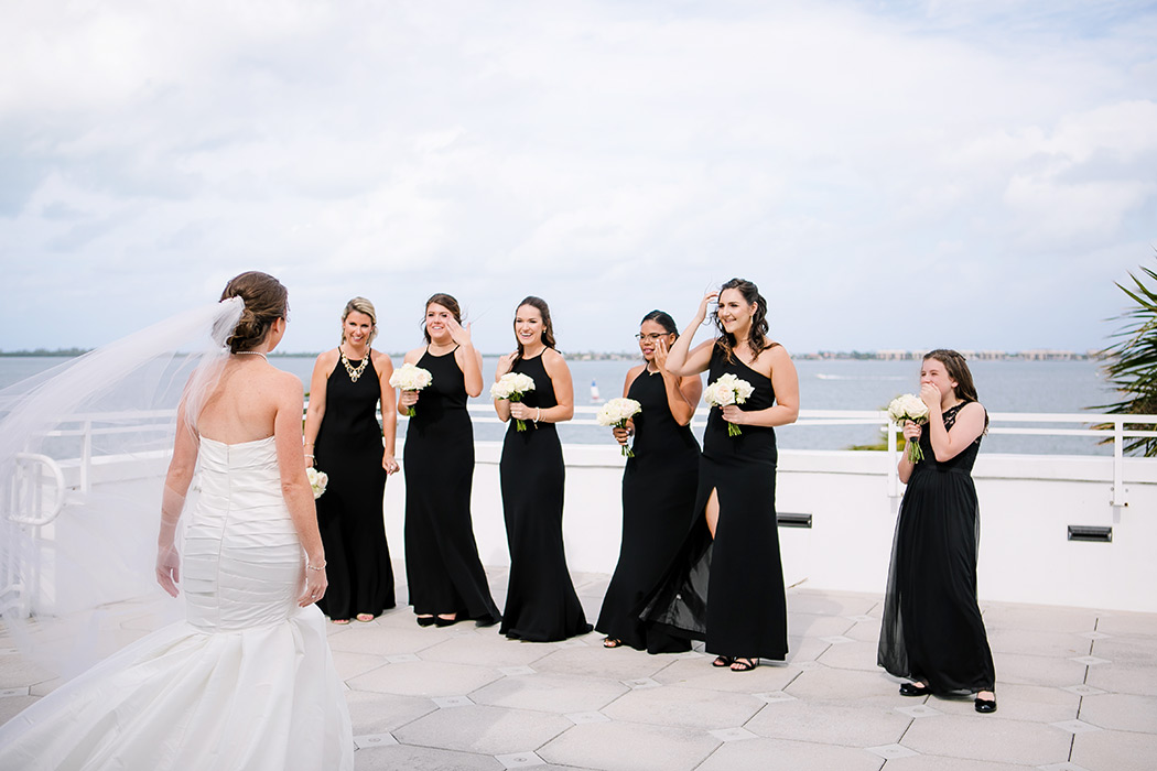 bride reveals dress to her bridemaids during first look | first look with bridesmaids | fort lauderdale wedding photographer | unique first look