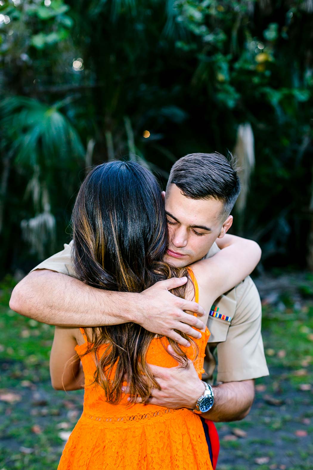 couple embrace during engagement photoshoot hugh taylor birch park | military man hugs his fiance