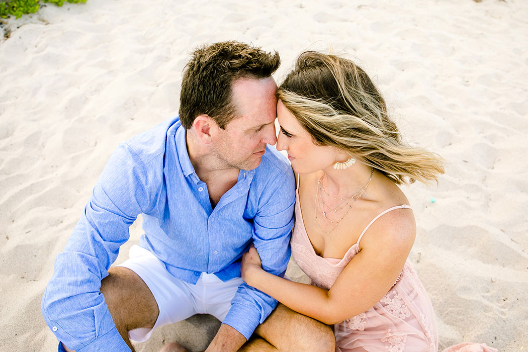 adorable fort lauderdale beach proposal | unique couples pose on beach | sitting down pose for couples