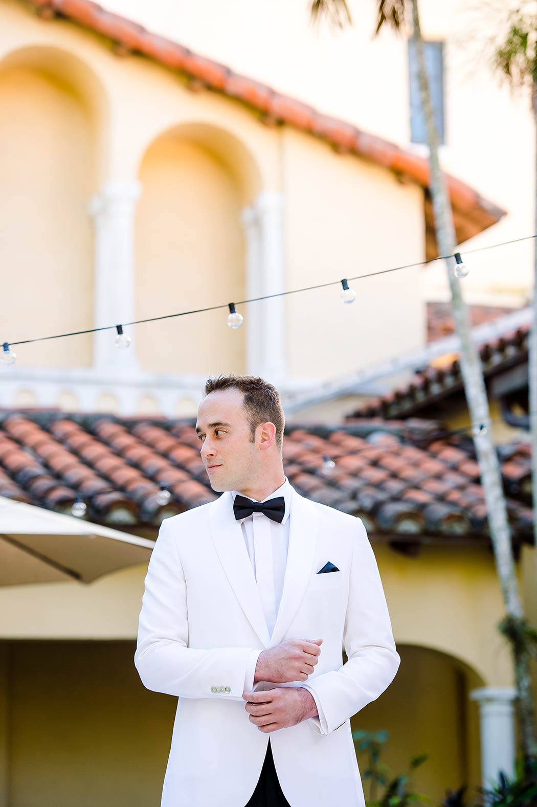 groom in white tuxedo posing for getting ready photographs | miami wedding groom | coral gables congregational church wedding | fort lauderdale wedding photographer